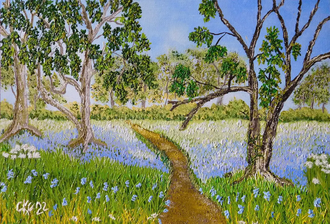 a river with trees and flowers