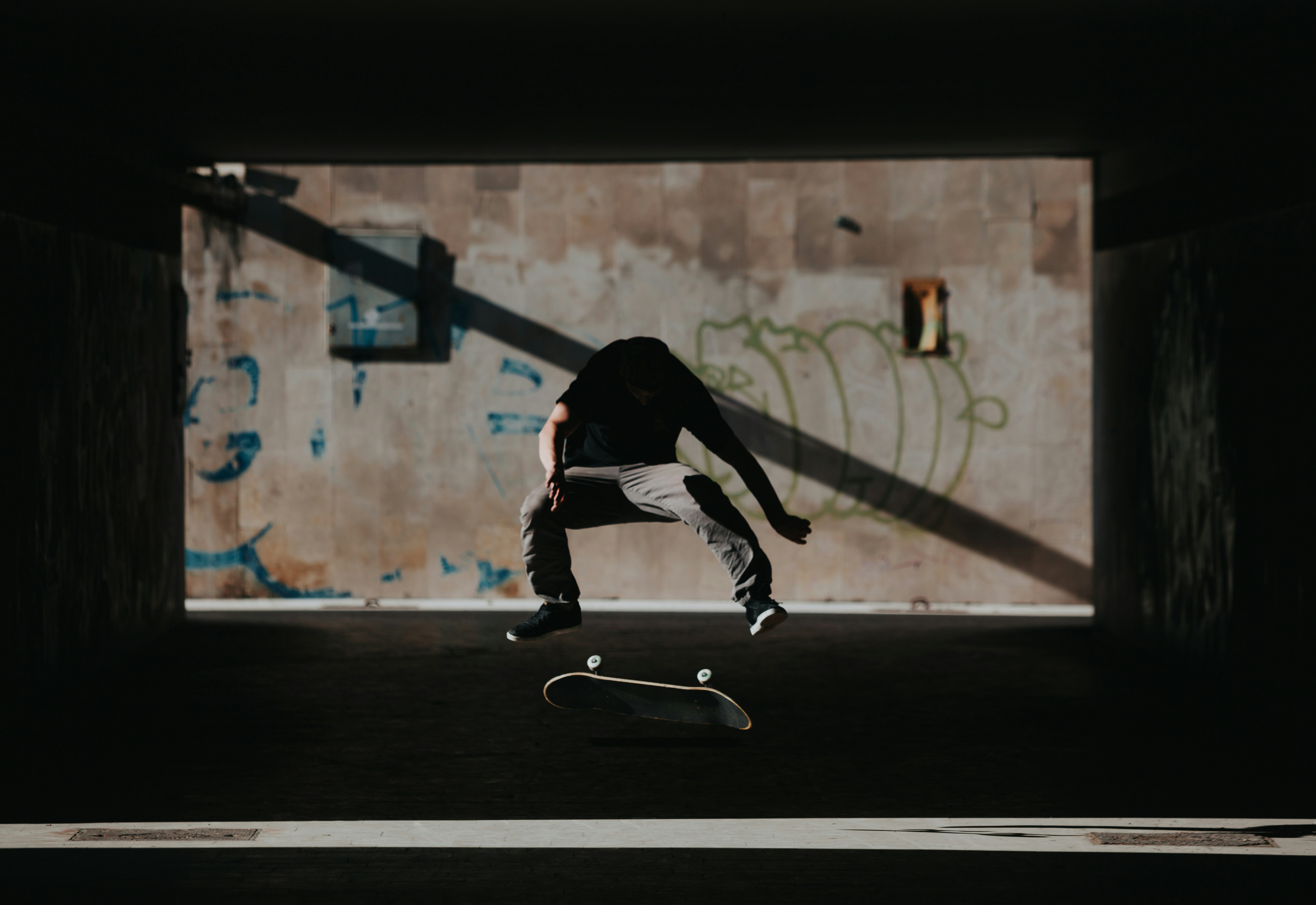 a person jumping a skate board in the air